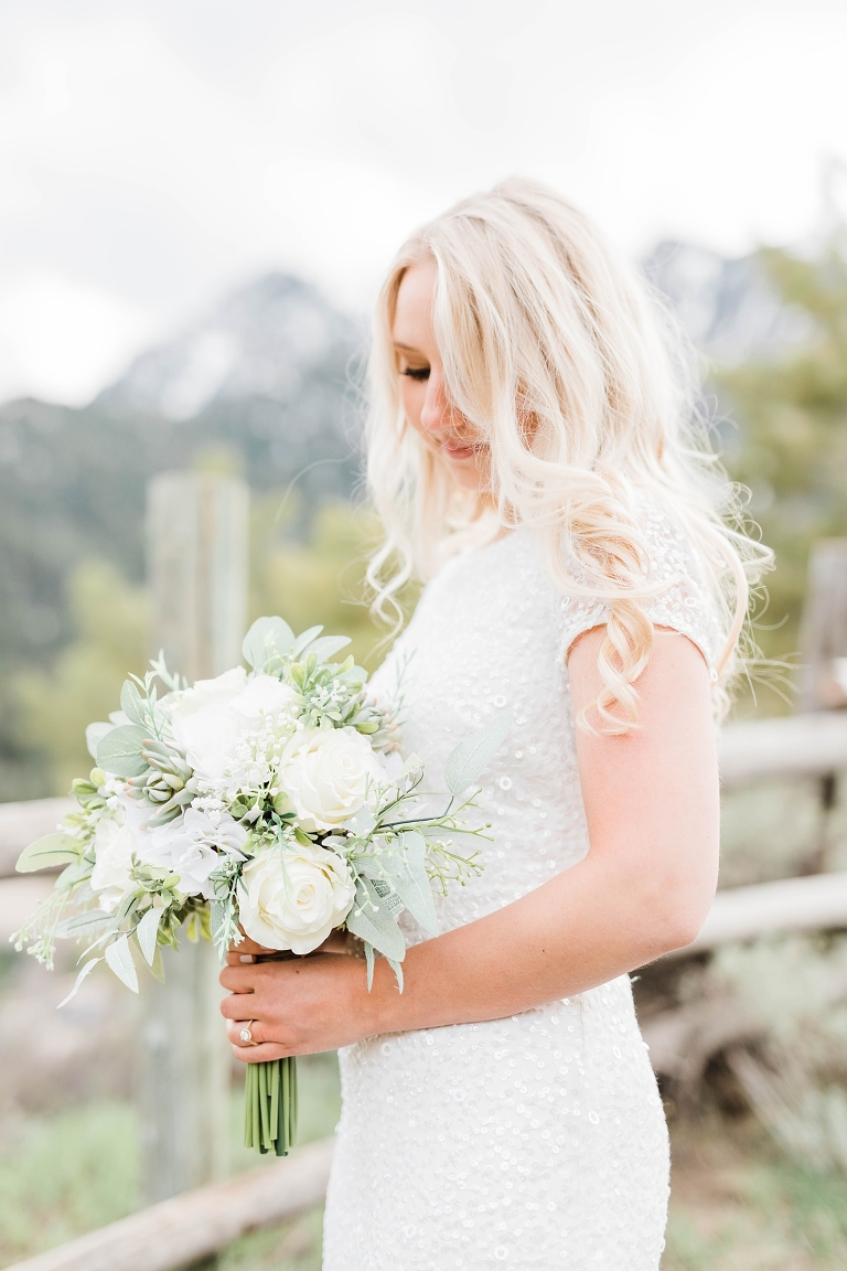 Utah Mountain Wedding Photography at Tibble Fork Reservoir, Utah bride photography, modest wedding dress, long bridal hairstyle, silk flowers white wedding bouquet