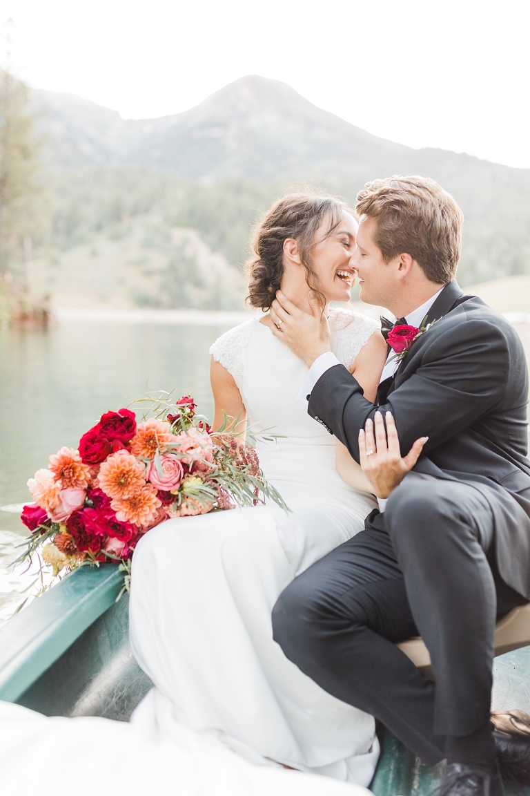 Tibble Fork Reservoir Couple in a Canoe, Utah Wedding Photography, Bride and Groom on lake, bright pink bouquet