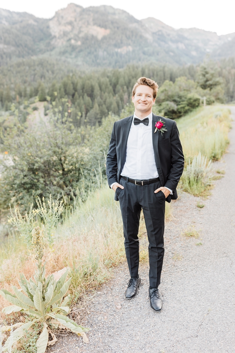Tibble Fork Reservoir Couple in a Canoe, Utah Wedding Photography, groom in classic black tuxedo and black bow tie