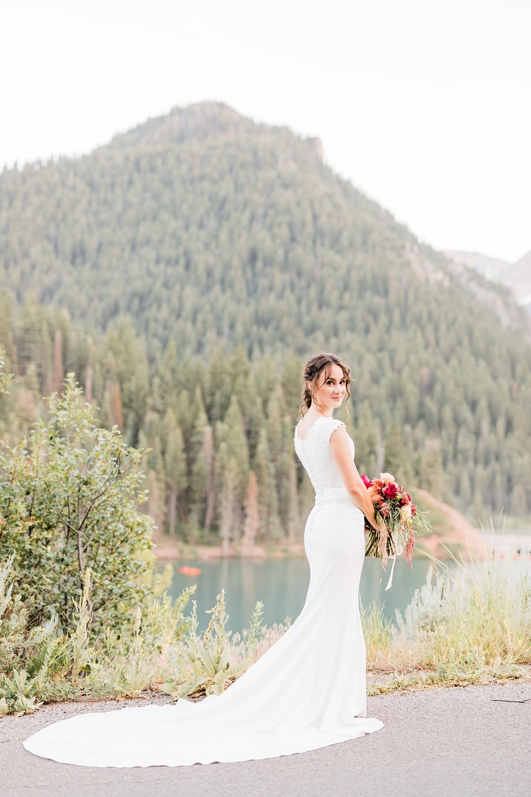 Tibble Fork Reservoir Couple in a Canoe, Utah Wedding Photography, Bride in modest modern wedding dress, bright pink bouquet wedding flowers