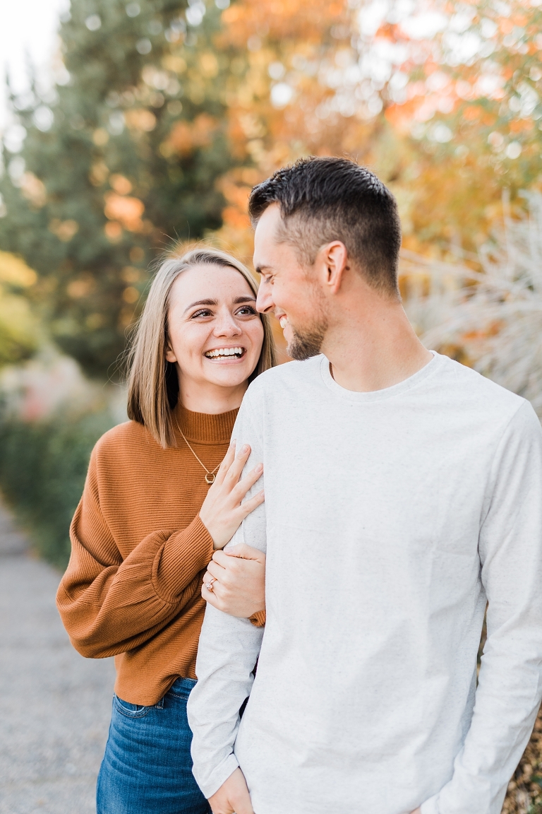 fall engagement photos at Memory Grove Utah engagement photography, brown white sweater fall outfits, what to wear for engagement photos, road trip questions for couples