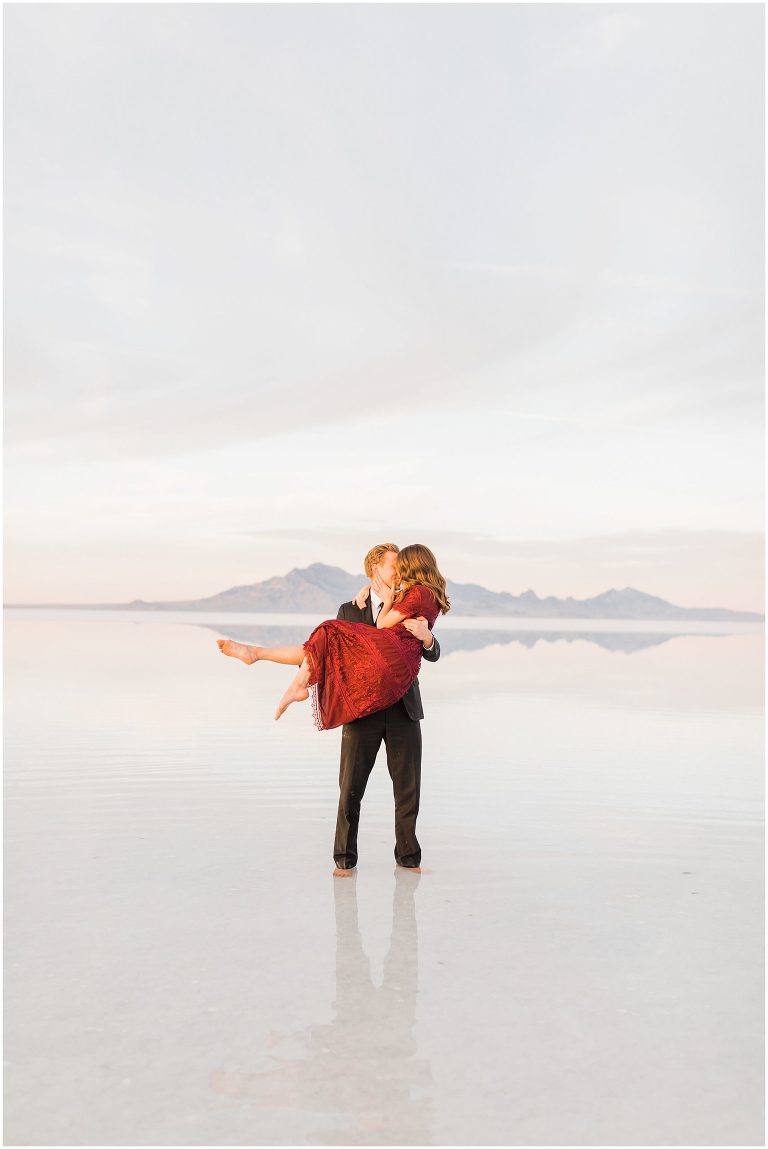 Bonneville Salt Flat couples photo session, Red dress and black suit for engagement pictures, What to wear to the Salt Flats, Photography by Tasha Rose